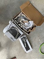 Unboxed Delta faucet components and packaging showing new condition and included items.