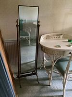 Front view of the full-length cheval mirror showing overall shape and size in room context