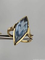 Top-down view showing marquise-cut aquamarine in bezel setting