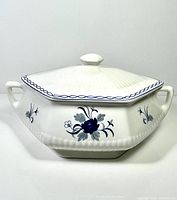 Front view of Adams Baltic lidded casserole showing hexagonal shape, blue floral motifs, and dual handles.