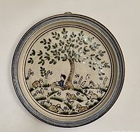 Front view of the large vintage ceramic wall plate showing the tree and sheep pastoral scene.