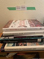 Stack of seven hardcover art and antiques books showing titles and condition.