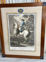 Full view of the framed engraving print showing the mounted rider on a white horse with decorative frame