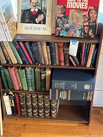 Front view showing the bookcase loaded with vintage books and LIFE magazines.