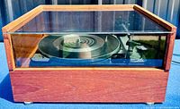Closed view of wood plinth turntable with clear acrylic cover