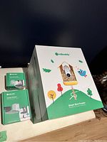 Bird Buddy Smart Bird Feeder large packaging box with smaller boxes for accessories on the side.