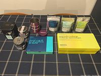 Overview of assorted David's Tea gift sets and tins arranged on table