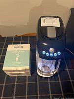 Sparkel beverage carbonation machine and one unopened box of carbonator sachets