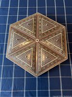 Top-down view of the closed octagonal sectional box showing detailed geometric and floral inlays.