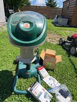 Overall view of trap unit assembled outdoors with accessory boxes and regulator at base