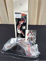 Ornament in original Hallmark packaging with Shaquille O'Neal dunking pose visible, card included behind ornament base.