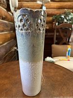 Tall ceramic vase with a cut-out lattice design near the top. Color gradient transitions from cream to green.