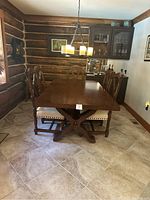 Front view of table and all six chairs in room