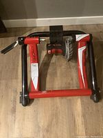 Top-down view of the bike trainer stand showing the frame and resistance roller