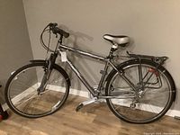 Full side view of the gray Norco Malahat bicycle showing frame, wheels, and seat.