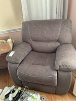Front view of grey recliner chair showing seat, back and arms
