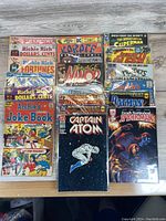 Photo overview of all comics showing a variety of titles including Richie Rich, Archie, Marvel, and DC characters.