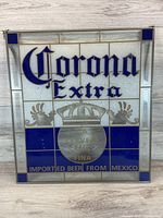 Front view of the stained glass sign showing Corona Extra logo with blue and gold accents on white frosted glass background.