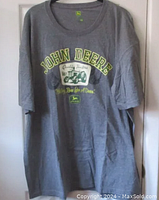 Full view of grey John Deere T-shirt showing front design and size 2X.