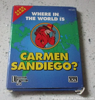 Front view of the game box showing title, brand, and illustration of Carmen Sandiego against a world map.