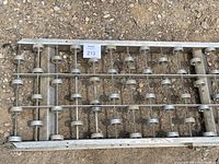 Another close-up image showing end section and roller arrangement within aluminum frame