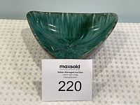 Front view of triangular Blue Mountain Pottery candy dish showing inside texture and color.