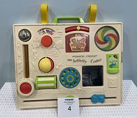 Front view of the complete vintage Fisher Price Activity Center showing all interactive features and overall condition.