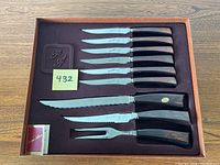 Full view of the boxed Pierre Alain cutting utensil set showing six steak knives, a carving knife, carving fork, and sharpening steel nestled in the original packaging.