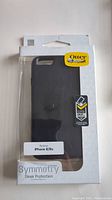 OtterBox Symmetry iPhone case in original packaging showing brand logo and protection features with label indicating compatibility for iPhone 6/6s.