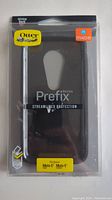 Front view of the OtterBox Prefix Streamline Protection case in original packaging showing model and compatibility for Moto E series.
