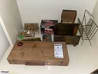 Overview of lot including wooden case, brass decorative words, copper recipe box, wire organizer rack.