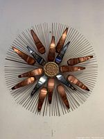 Front view of 30" diameter sunburst wall sculpture mounted on wall