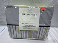 Packaged Fieldcrest luxury 4 piece double sheet set with gray and yellow striped design visible through packaging