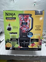 Front of factory-sealed Ninja Blender Duo box showing Auto-IQ, Micro-Juice technology and two blending cups