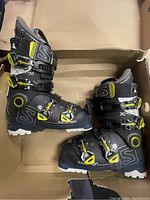 Pair of Salomon X Pro 120 boots in shipping box, side by side view
