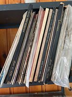 Side view of over 30 classical LP albums and boxed sets including titles by Benjamin Britten and others. Shows condition and variety.