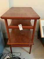 Front view of both tables showing top, middle and bottom shelves