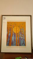 Full view of framed and matted print showing tree silhouettes and yellow moon