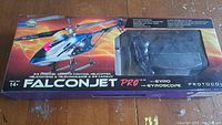 Boxed Falconjet Pro 3.5 channel remote control helicopter showing model name, graphics, and helicopter visible through packaging window.