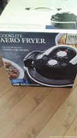 Photo showing the front of the Cooklite Aero Air Fryer box with image of the air fryer and key features.