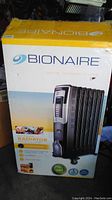 Front view of the Bionaire heater box showing product image, brand, and features.