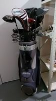 Full view of navy gray Strata golf bag filled with assorted golf clubs