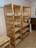 Two IKEA Ivar wooden shelving units side by side in room, showing overall design and size difference.