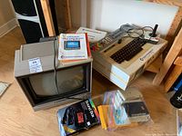 Wide shot showing VIC-20 unit, monitor, Datassette, joystick, HES Sound Box and cables