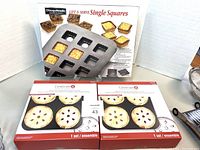 Chicago Metallic Single Squares pan with 12 square sections and two boxed Celebrate It mini pie pans