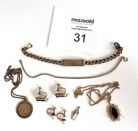 Vintage 12k and 14k gold filled jewelry lot laid out including bracelet, necklaces, pendants, and various pairs of screw-back earrings.