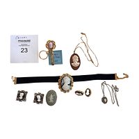 Full lot assortment of cameo costume jewelry including bracelets, earrings, pendants, keychain and ring.