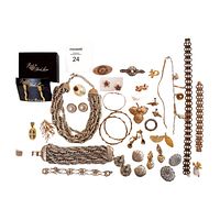 Full lot of costume jewelry including necklaces, bracelets, earrings, and brooches laid flat showing variety of items.