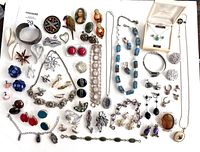 Full layout of all vintage jewelry items on white background showing diverse collection of earrings, necklaces, bracelets, brooches, and rings.
