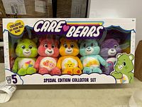 Front view of Care Bears special edition collector set featuring five bears in window box packaging labeled Care Bears Special Edition Collector Set, with badge stating exclusive Do-Your-Best Bear.